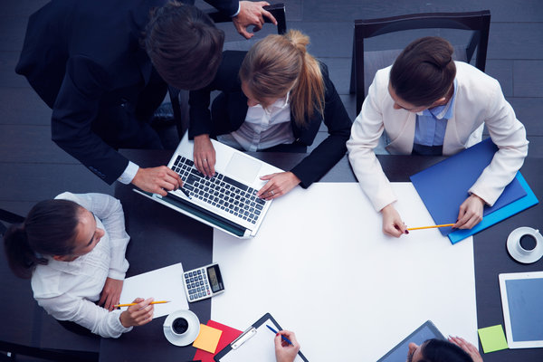 A team collaborating around a table during a planning session